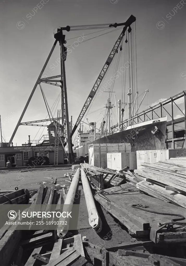 Vintage photograph. Loading of a freighter at dock, New York City