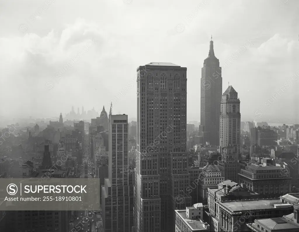 Vintage photograph. View of Manhattan skyscrapers and Park Avenue from rooftop with Empire State building on the right.