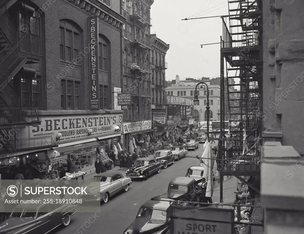 Vintage photograph. Looking south along Ludlow Street showing sidewalk shops and tenement houses, New York City