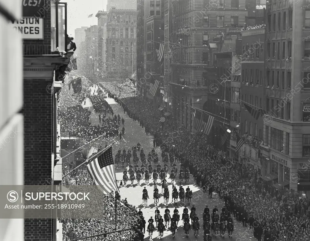 Vintage photograph. Wide shot of Policemen on Horses in Famous New York City Ticker Tape Parade For MacArthur In 1951