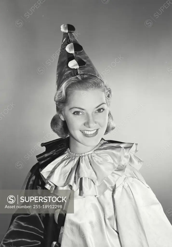 Vintage photograph. woman in clown suit smiling looking at camera