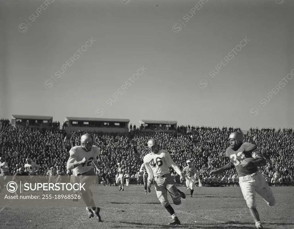 Vintage photograph. player running down sideline during Columbia vs yale at baker field in October 1951