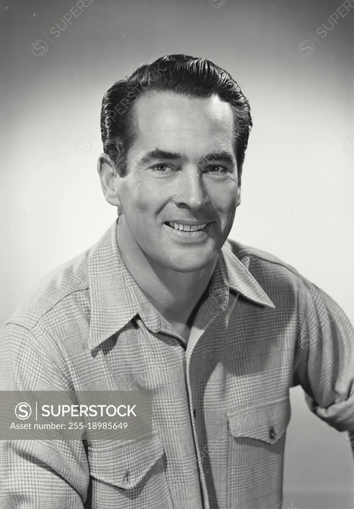 Vintage photograph. man in button shirt smiling at camera