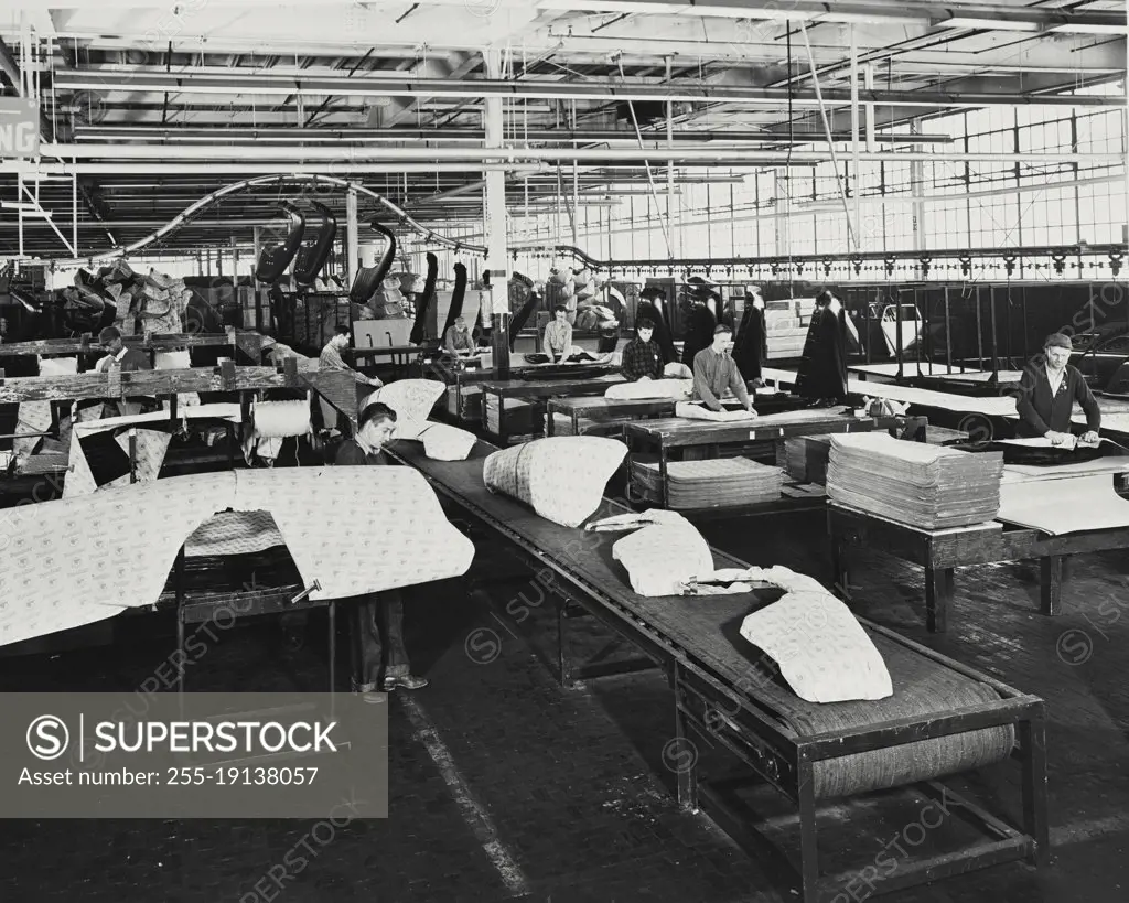 Vintage photograph. Fenders and other sheet metal parts are wrapped in protective corrugated paper for shipment by rail and motor truck to warehouses throughout the world