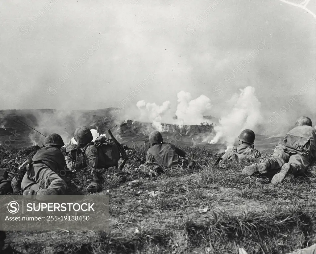 Vintage photograph. Marines of the first division fighting the Japanese held by hail in their drive for Naha, capital city of Okinawa