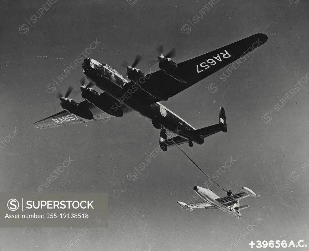 Vintage photograph. Air to air refueling of a USA fighter jet employing the British probe-drogue system