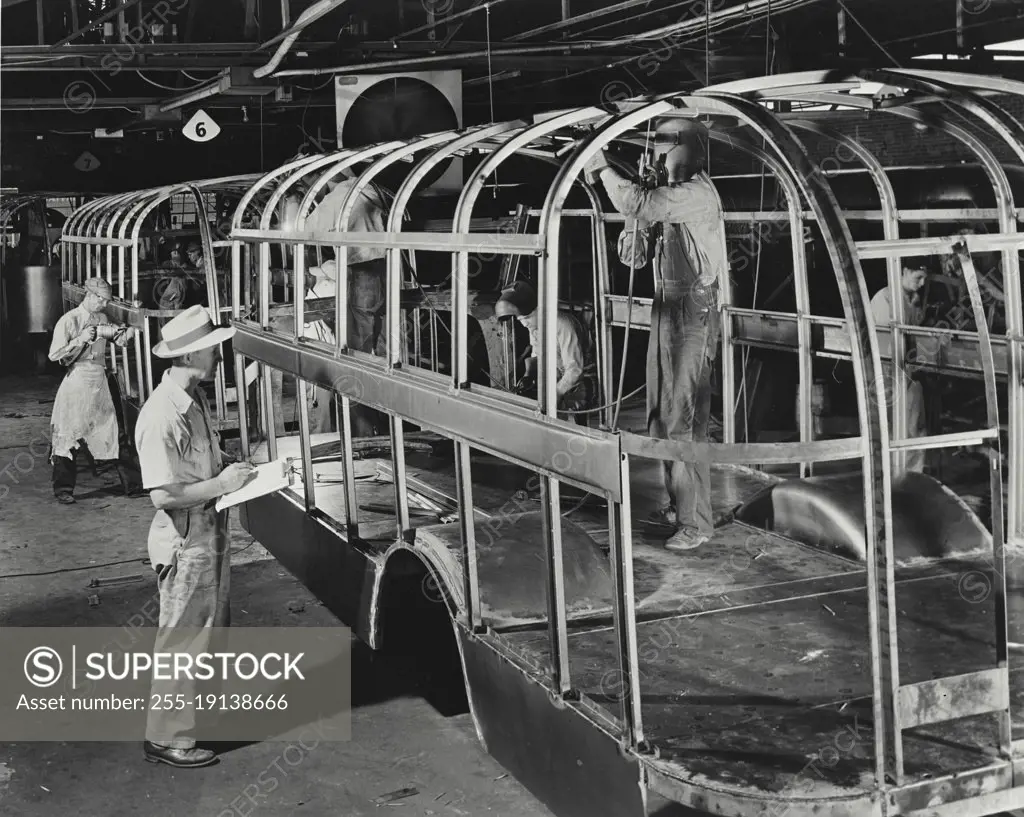 Vintage photograph. On the production line at Ward Body Works, Inc. building high strength steel frames for school bus bodies