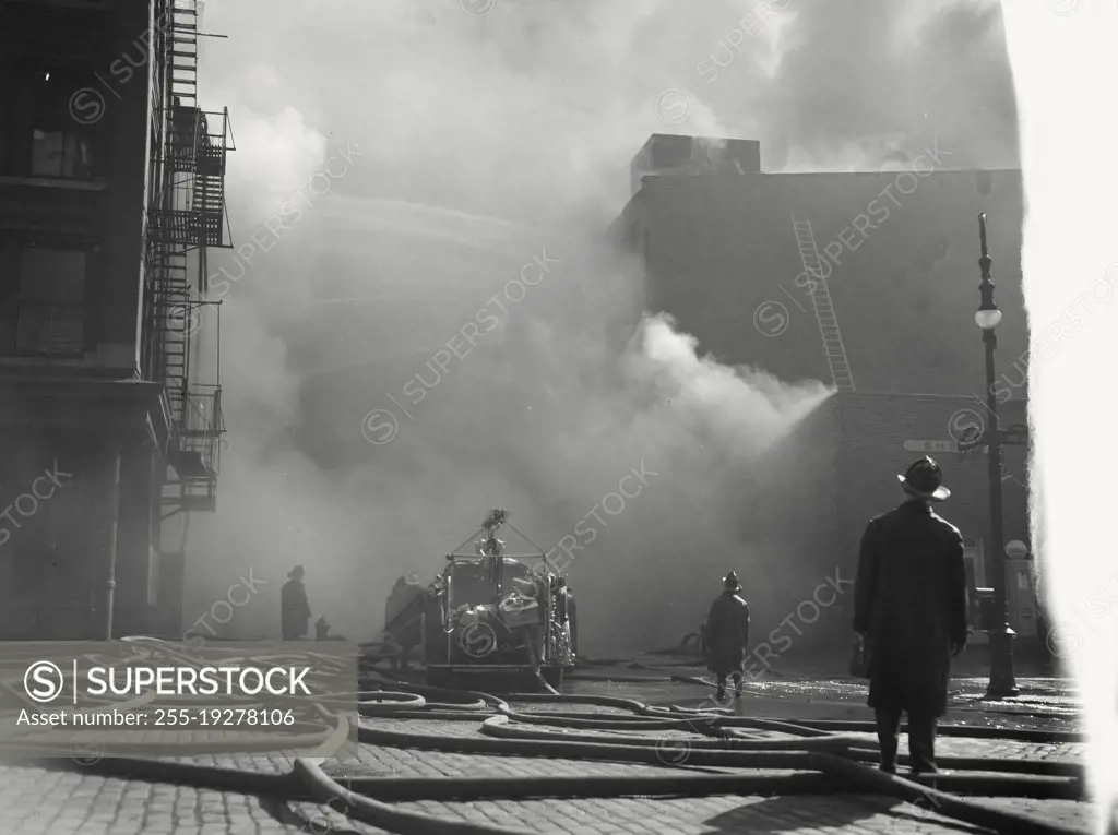 Vintage photograph. Five-alarm fire that raged through a five story export warehouse