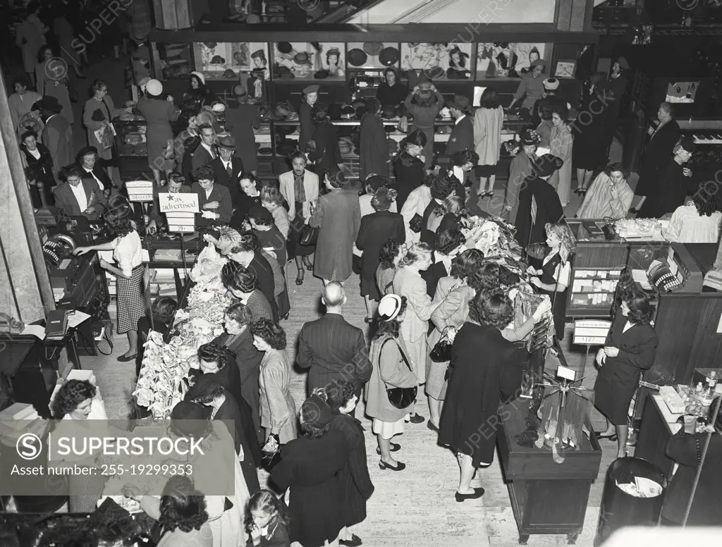 Vintage photograph. Shopping crowd on main floor of R.H. Macy Company, New York City