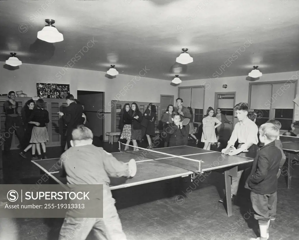 Vintage photograph. Kids playing table tennis at a party at Gonzales Gardens Public Housing, completed in September 1940 in Columbia South Carolina