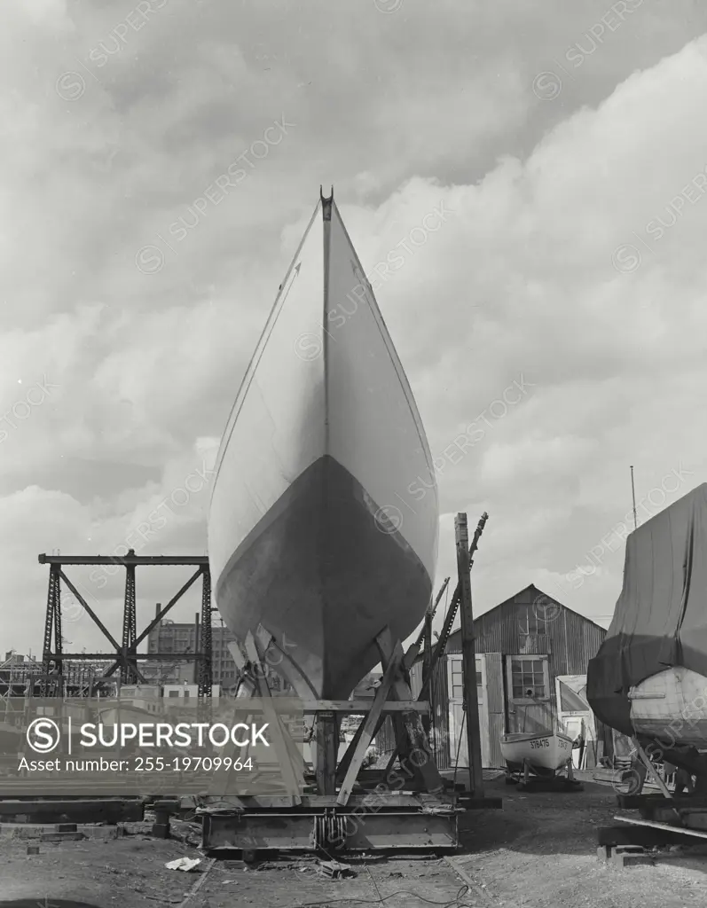 Vintage photograph. Sport sailboat in drydock