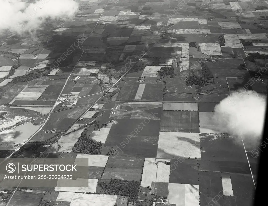 Aerial view near Richmond, Indiana during corn planting time of year. On the left is junction of US 40 and US 35. In the center is a small independent airport (East Richmond Airport)