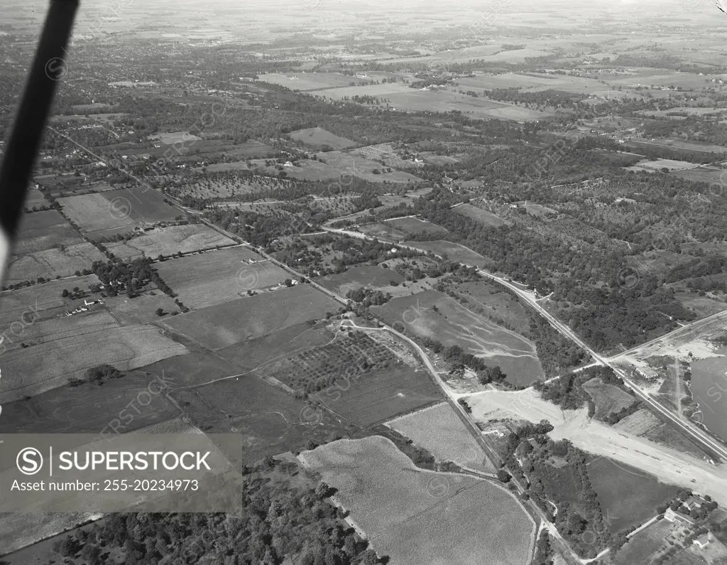 Aerial view of Richmond, Indiana. Rebuilding of Route 40 to correct a "killer intersection" with US 35. In middle distance is a section of land belonging to SW Hayes and is an Arboretum of some note