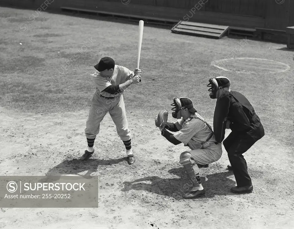 Baseball player at bat waiting for pitch