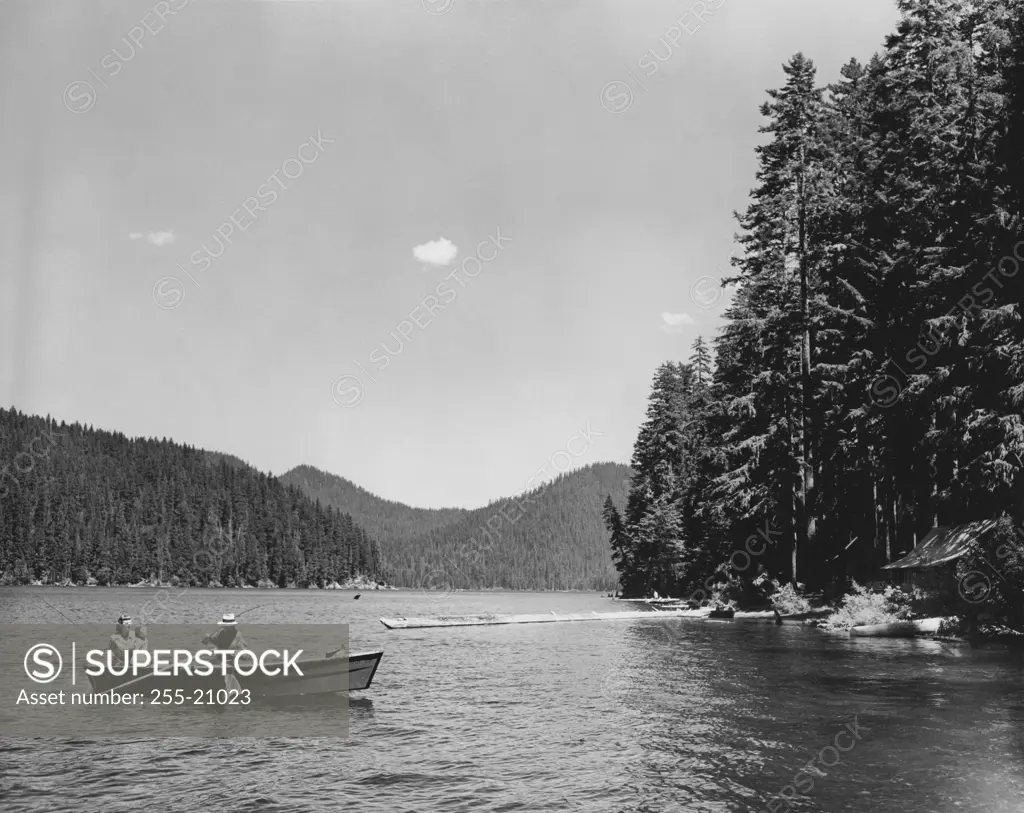 Parents with their child fishing in a lake, Spirit Lake, Washington, USA