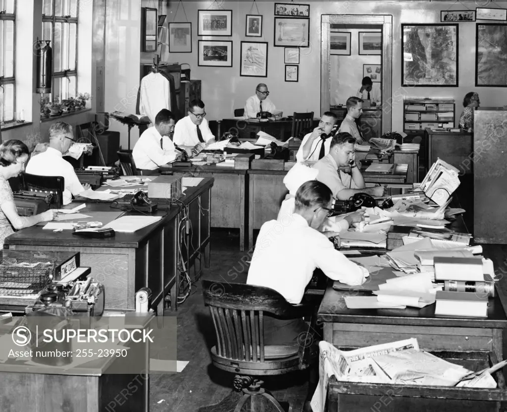 Office workers working in a press room