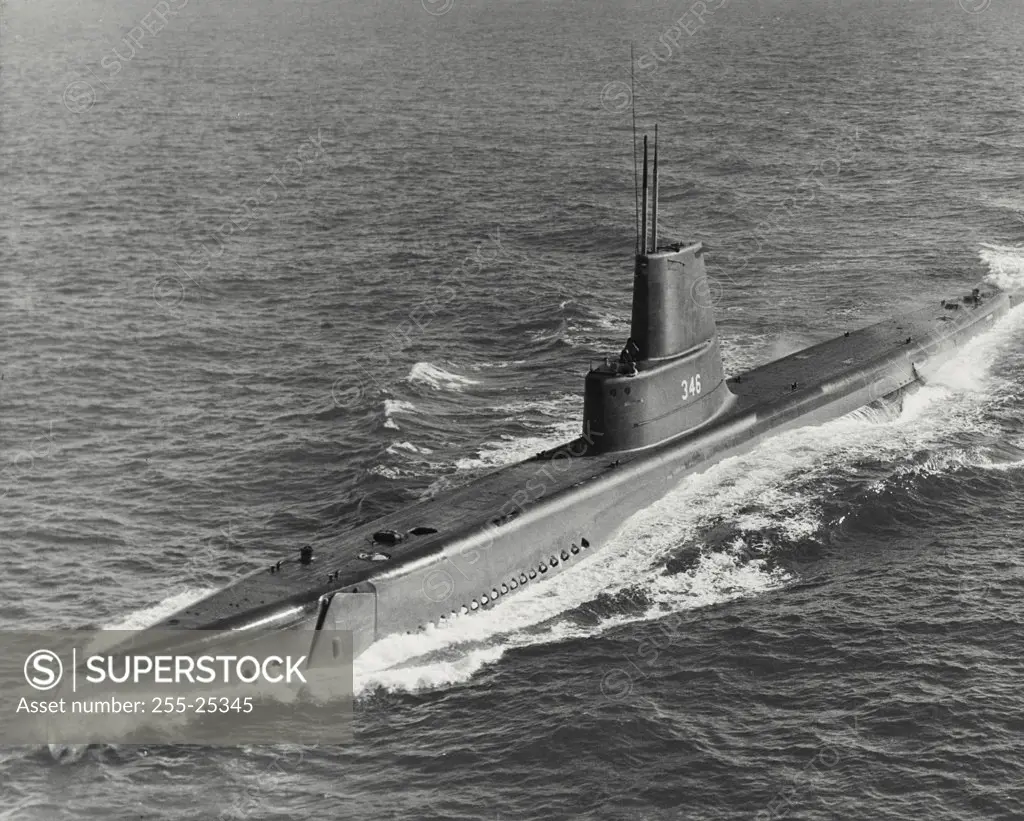 Vintage photograph. High angle view of submarine USS Corporal (SS-346) following streamlining to increase underwater speed