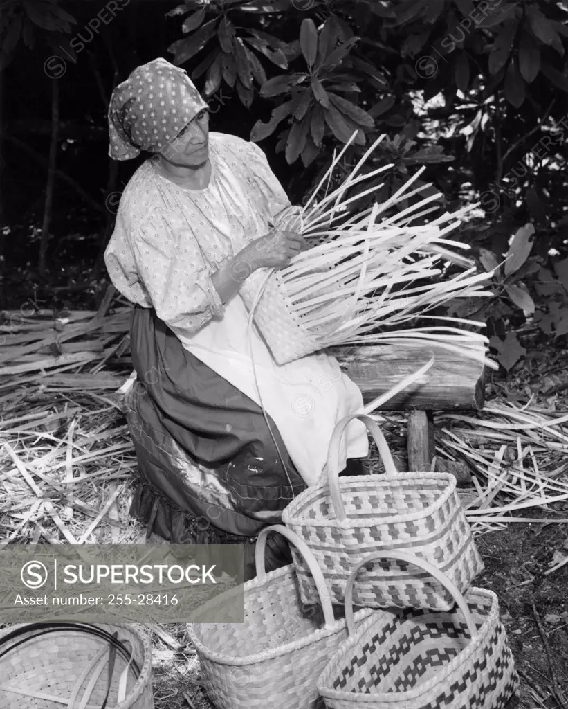 Cherokee woman weaving a basket