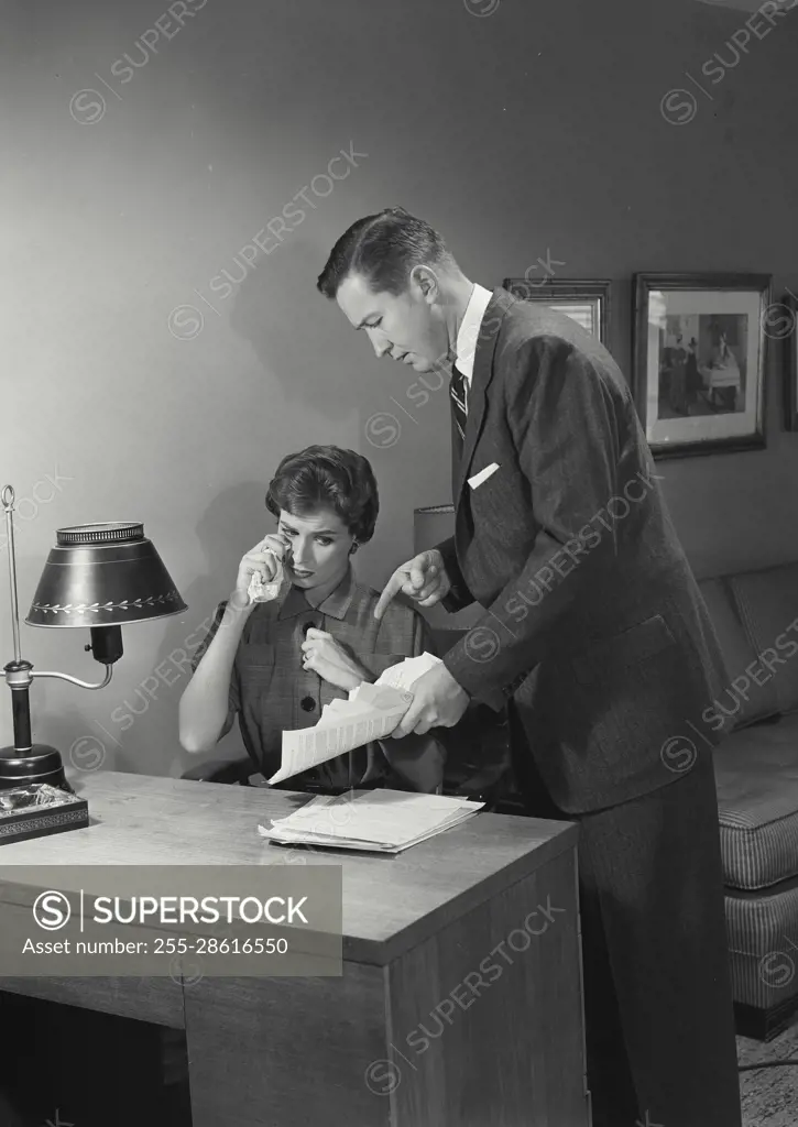 Vintage Photograph. Byron Carlson. Jane Carlson. Models Released. Husband arguing with wife over bills.