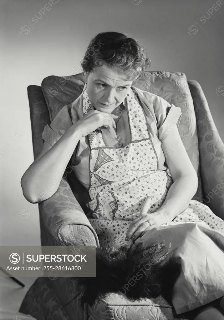 Vintage Photograph. Virginia N Weed. Model Released. Tired woman in apron sitting in chair from cleaning. Frame 4