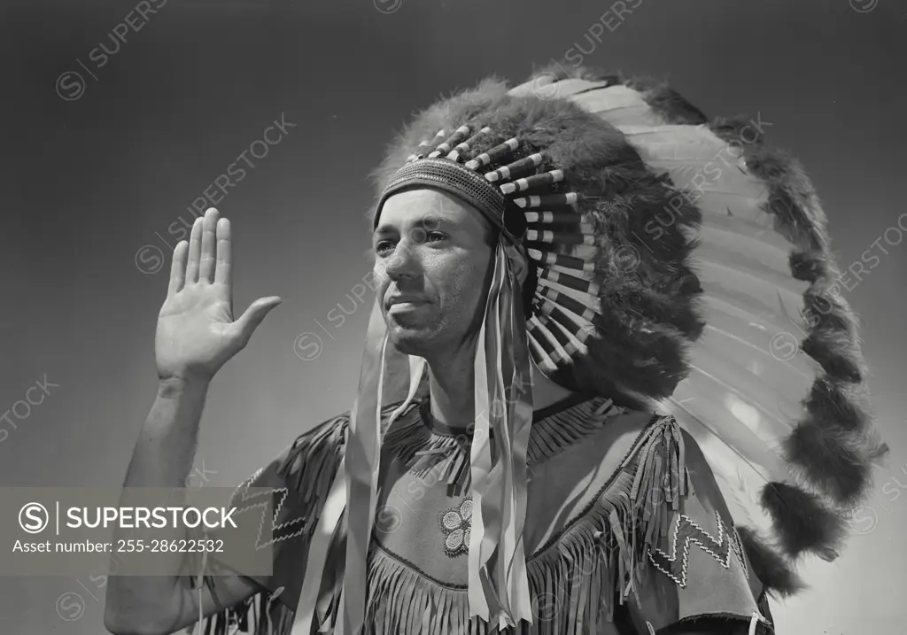 Vintage Photograph. Caucasian man in Native American head dress. Frame 5