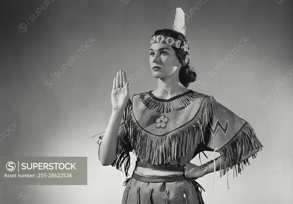 Vintage Photograph. Caucasian woman wearing Native American head dress. Frame 5