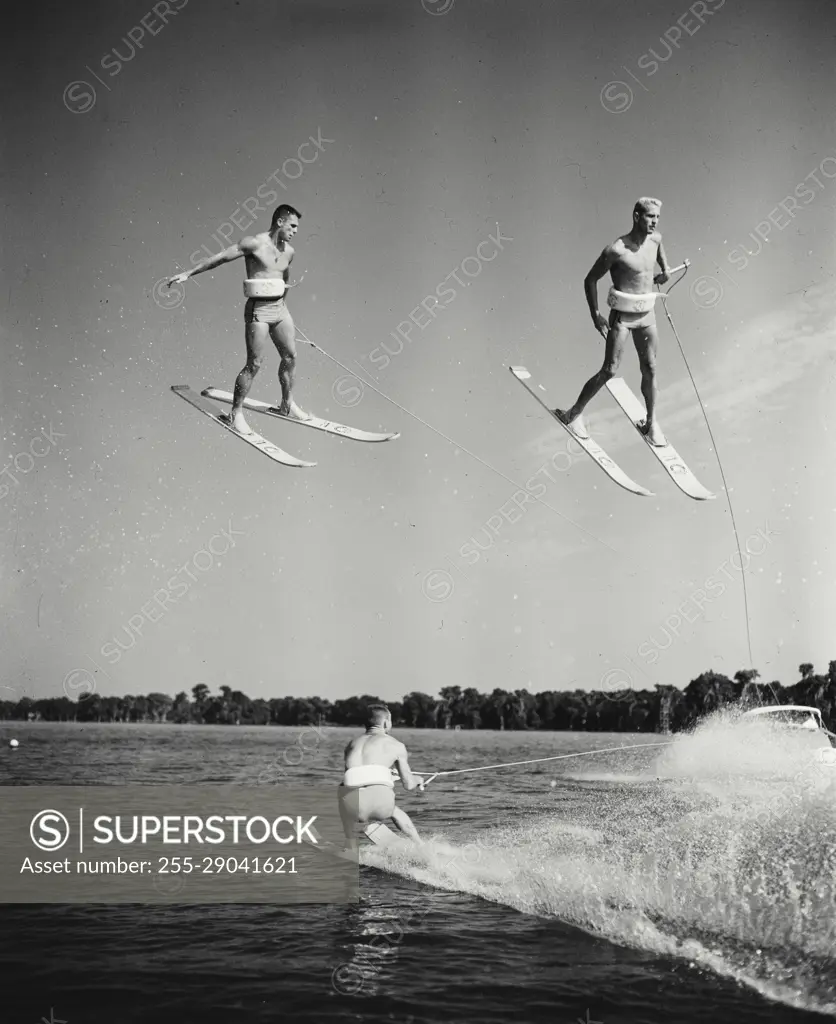 Vintage Photograph. Helicopter stunt during professional water skiing exhibit