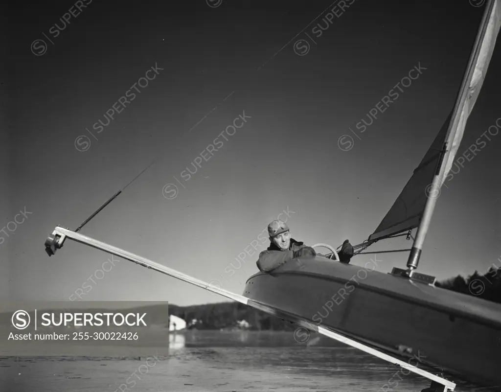 Vintage Photograph. Iceboating- closeup of man in boat.