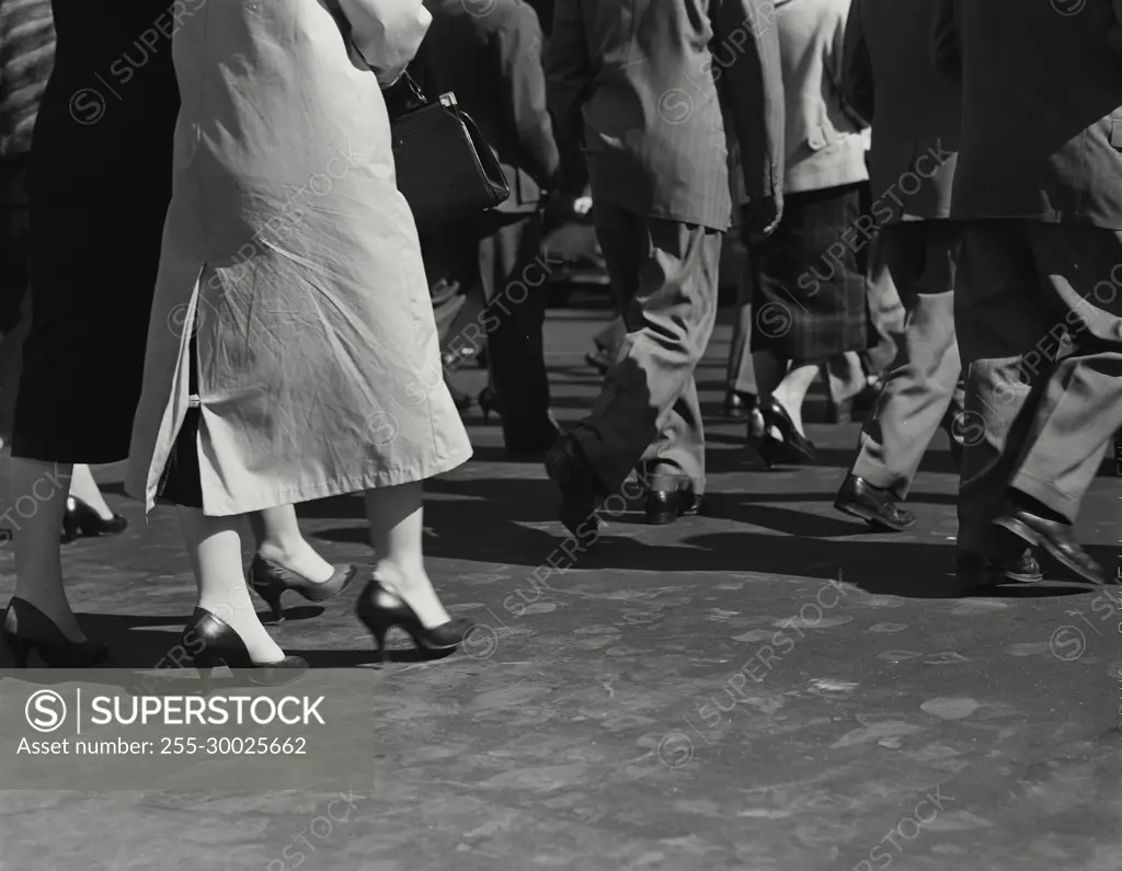 Vintage Photograph. Legs of pedestrians walking on sidewalk, Frame 4