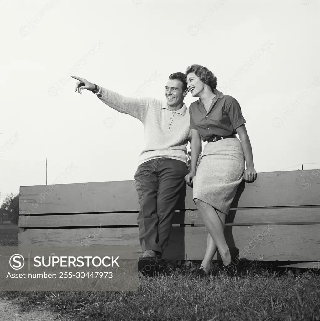 Vintage Photograph. Portrait of young couple in golf clothes. Frame 5