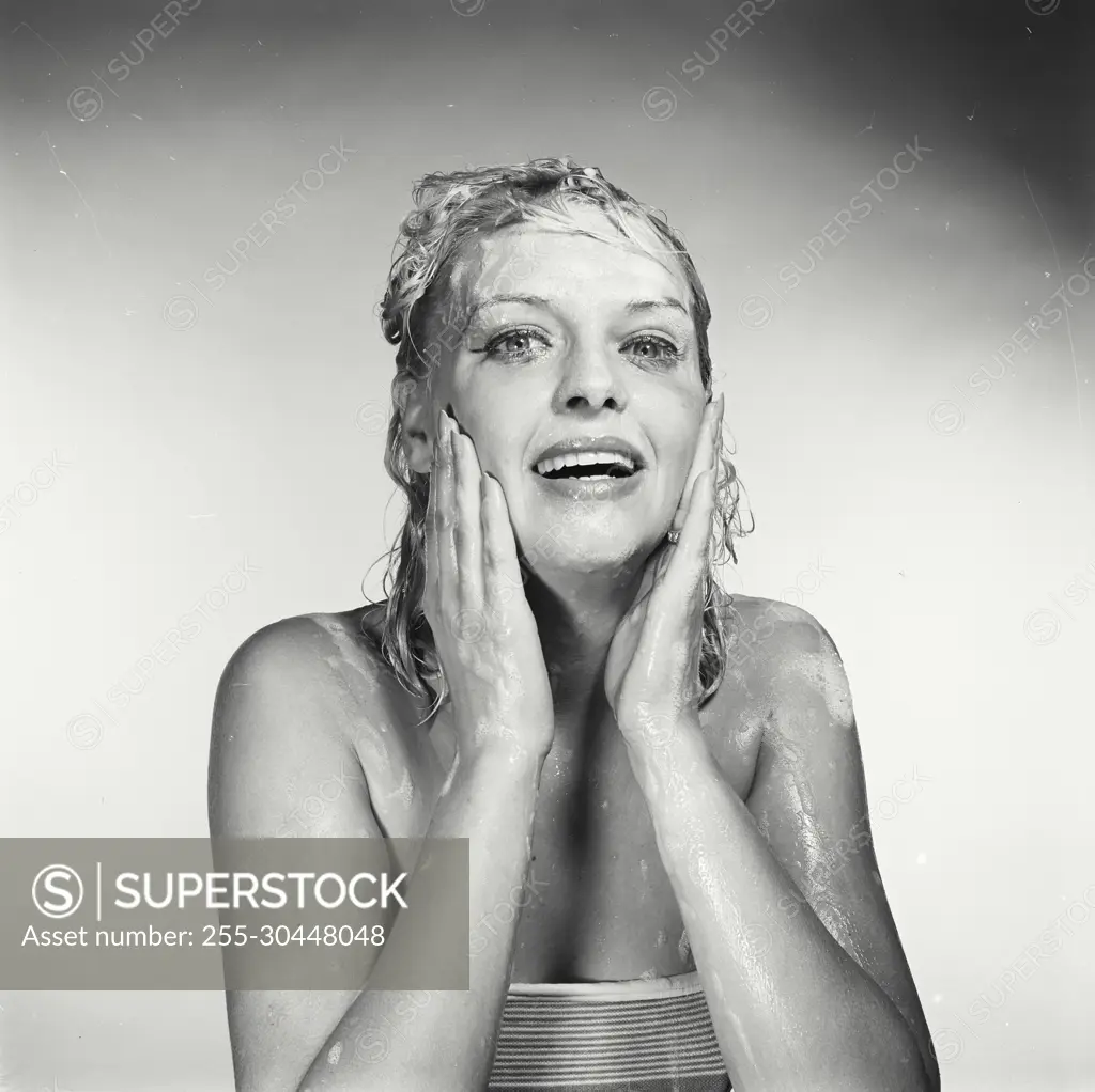 Vintage Photograph. Woman washing her face. Frame 4