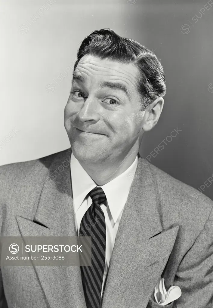 Vintage photograph. Portrait of businessman with funny smile