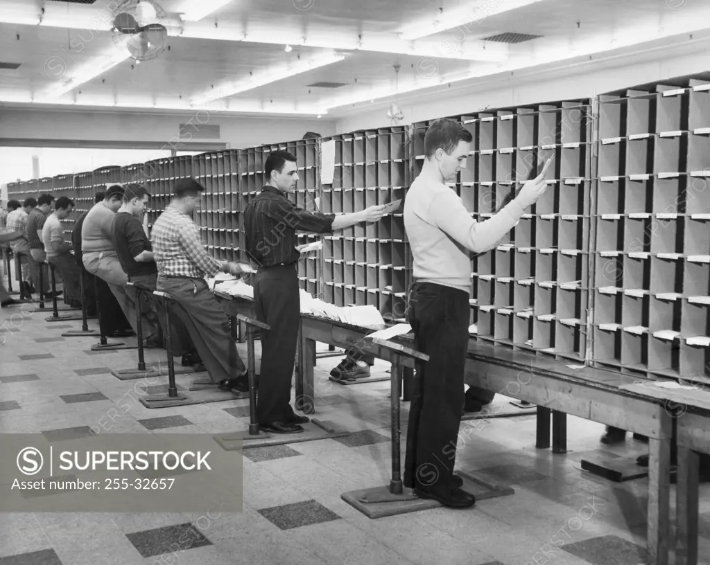 Postal workers sorting mail in a post office, Worchester, Massachusetts, USA