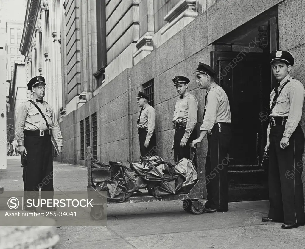 Vintage Photograph. The Ford run is a daily task for these three private payroll guards who moved the money often more than 3/4 of $1 million from downtown to Rouge Plant