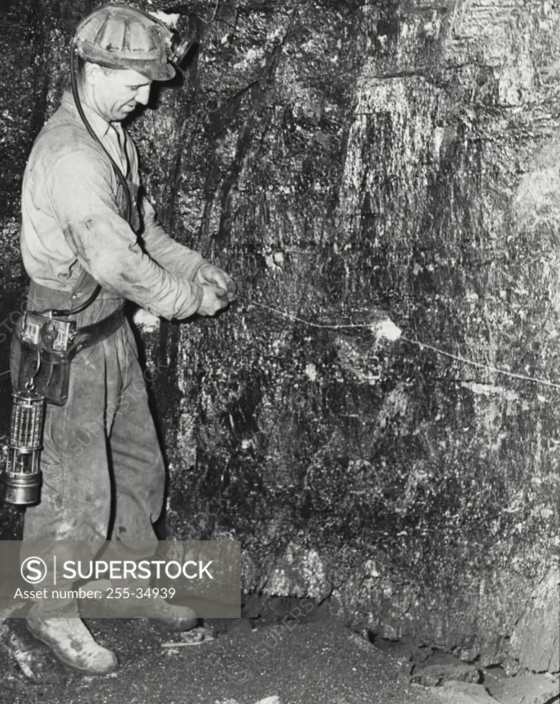 Vintage photograph. Wiring charges for a blast, and US steels Geneva coal mine