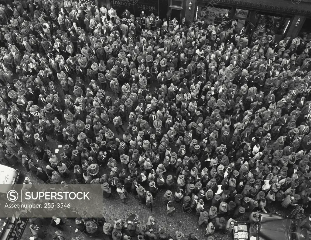 Vintage Photograph. Large crowd gathering around trucks. Frame 4