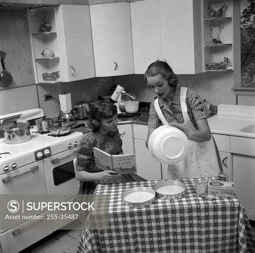 Two young women cooking