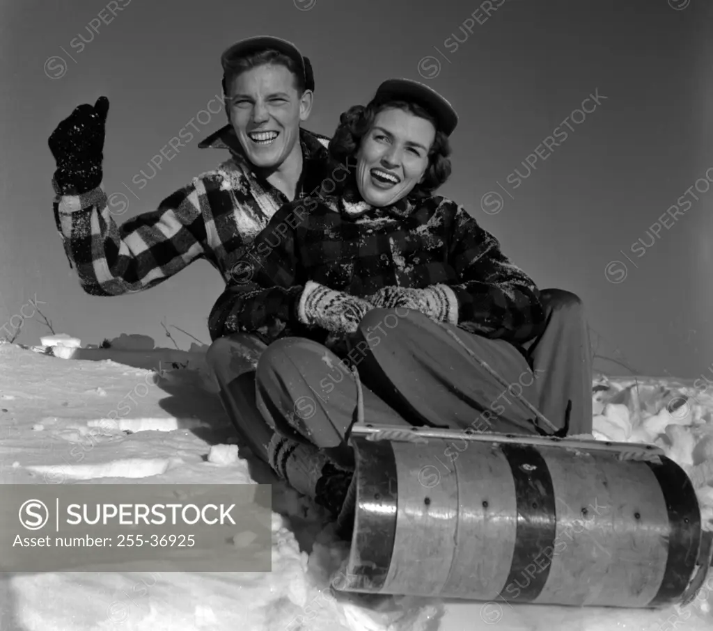 Young couple sleighing