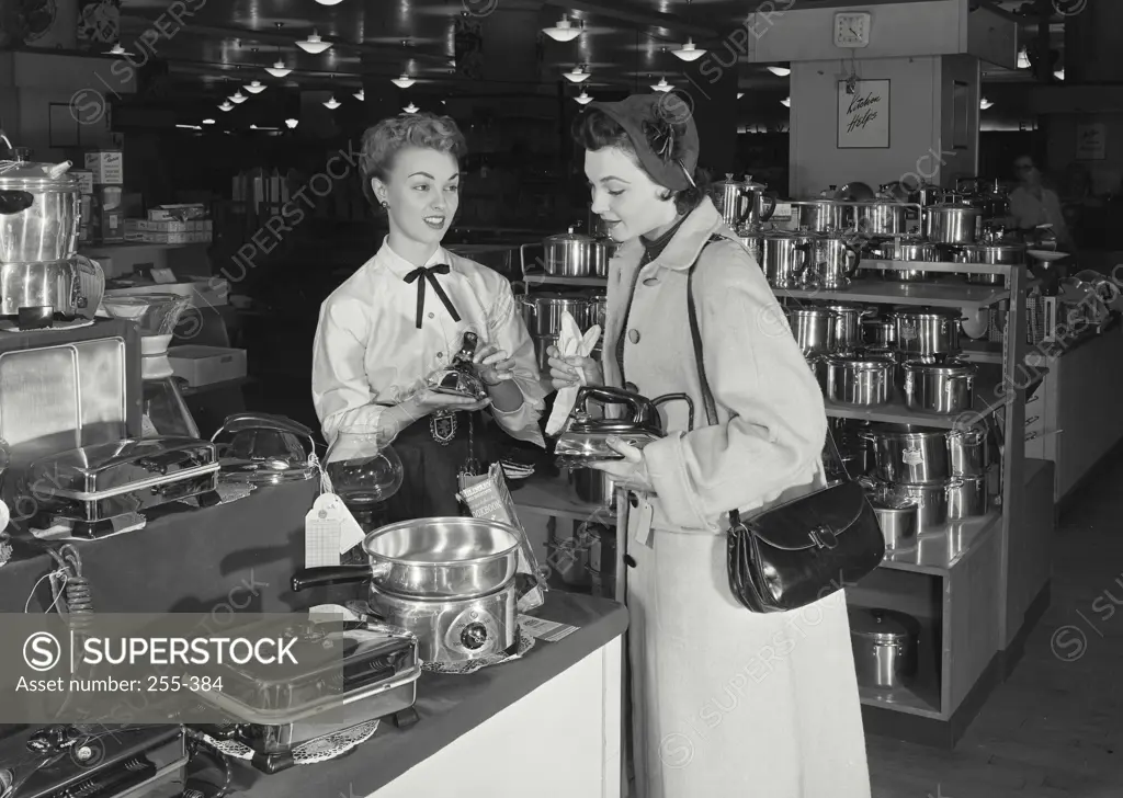 Vintage Photograph. Woman shopping for new iron