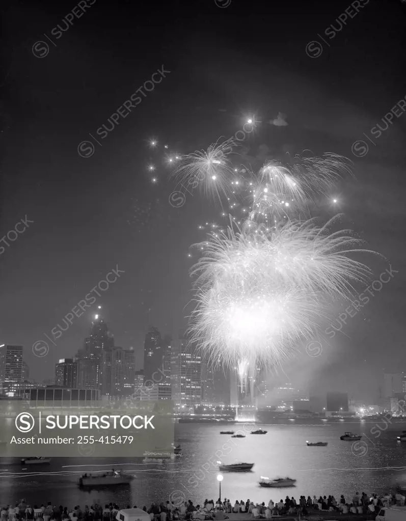 City skyline at night with fireworks