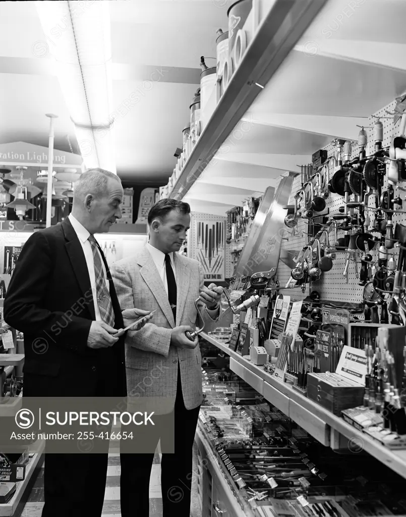 Man choosing tools in hardware store