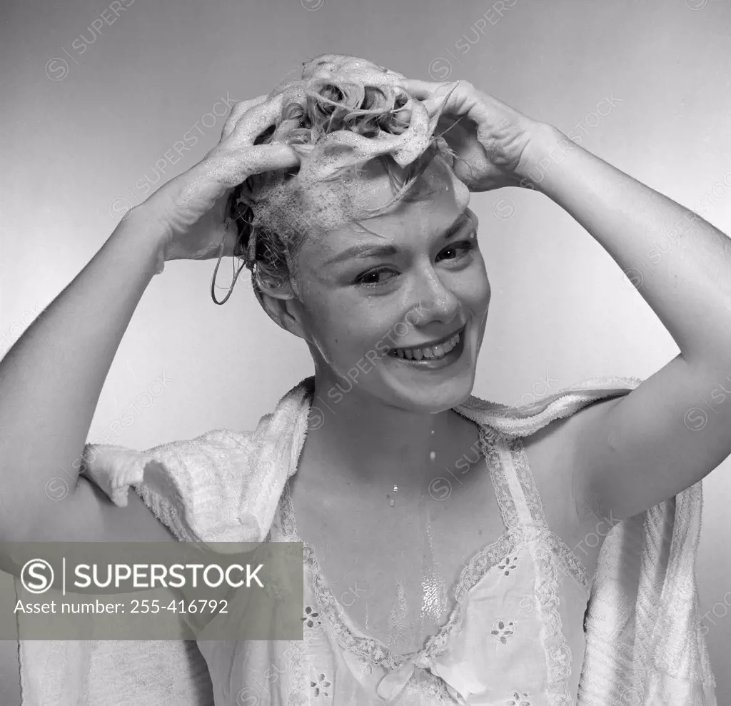 Mid adult woman washing hair