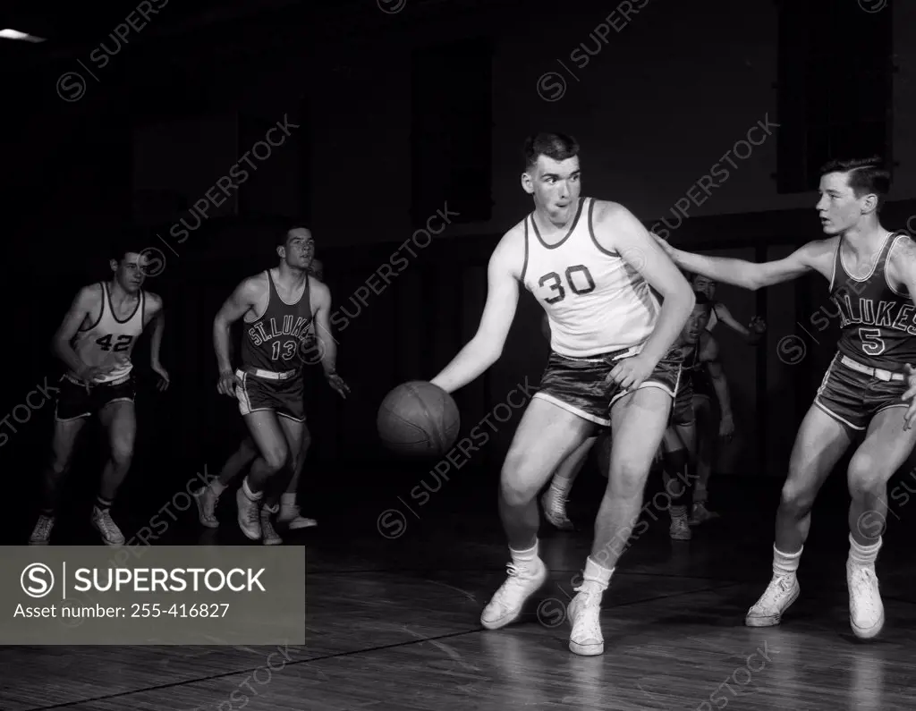 Men playing basketball