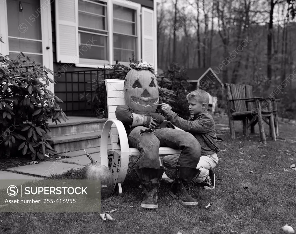 Boy preparing Halloween decoration