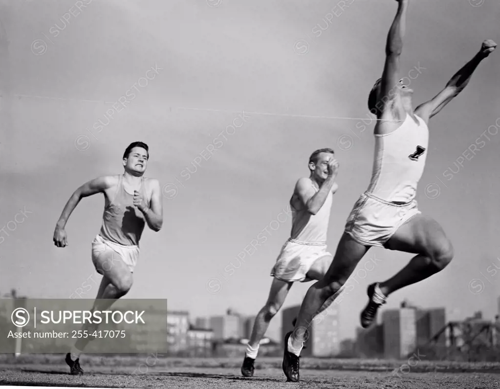 Three athletes running