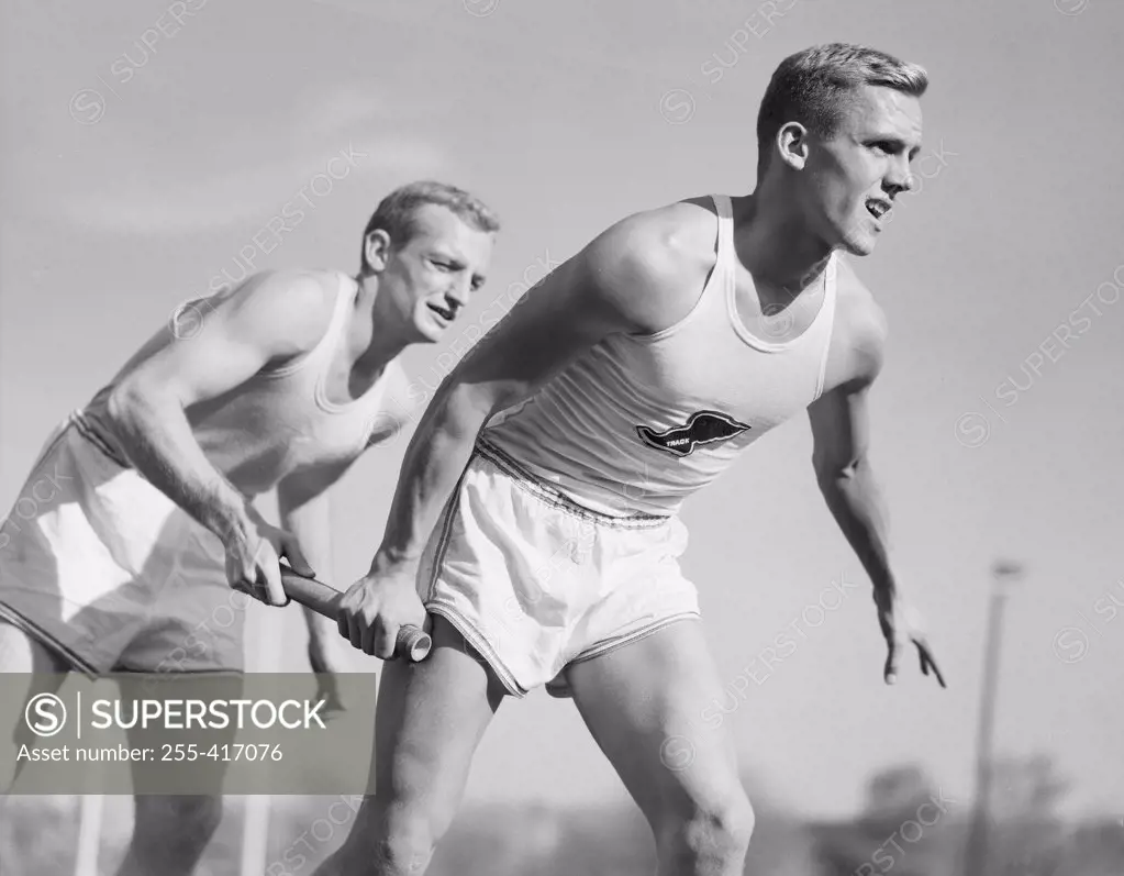 Two men running on relay