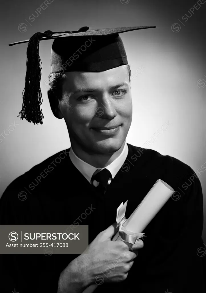 Portrait of man in graduating gown