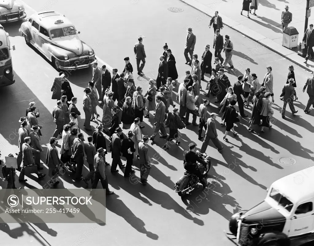 USA, New York City, high angle view of pedestrians crossing street