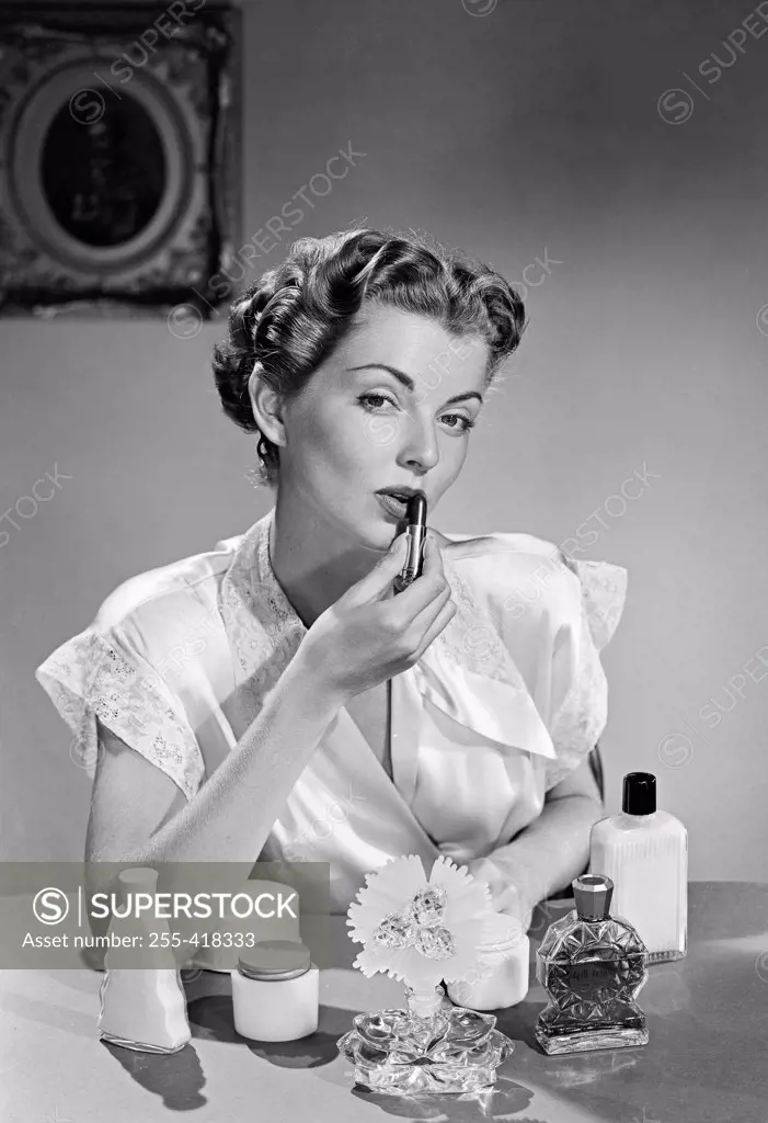 Woman applying make-up