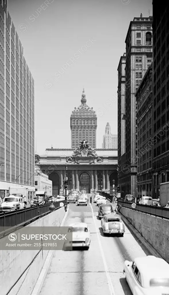 USA, New York State, New York City, View looking North on Park Avenue over ramp from vehicle tunnel, showing Grand Central Terminal and New York Central building in background